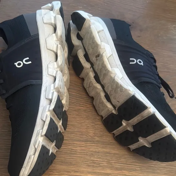 On Running Black and White Athletic Shoes with Cloud Cushioning