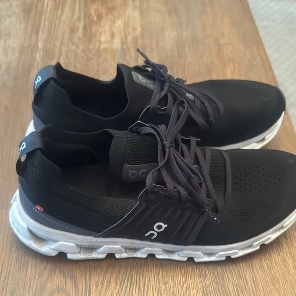 On Running Black and White Athletic Shoes with Cloud Cushioning
