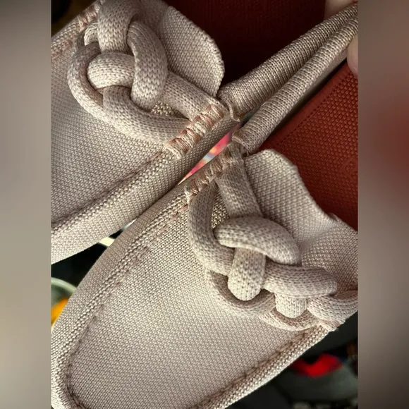 Pink Rothy’s flats knot detail