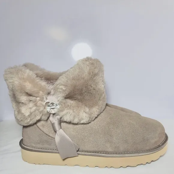 UGG Women's Size 9 Cinched fur mini boots.