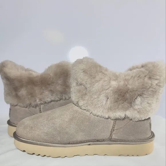 UGG Women's Size 9 Cinched fur mini boots.