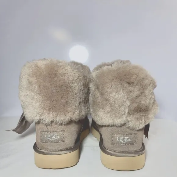 UGG Women's Size 9 Cinched fur mini boots.